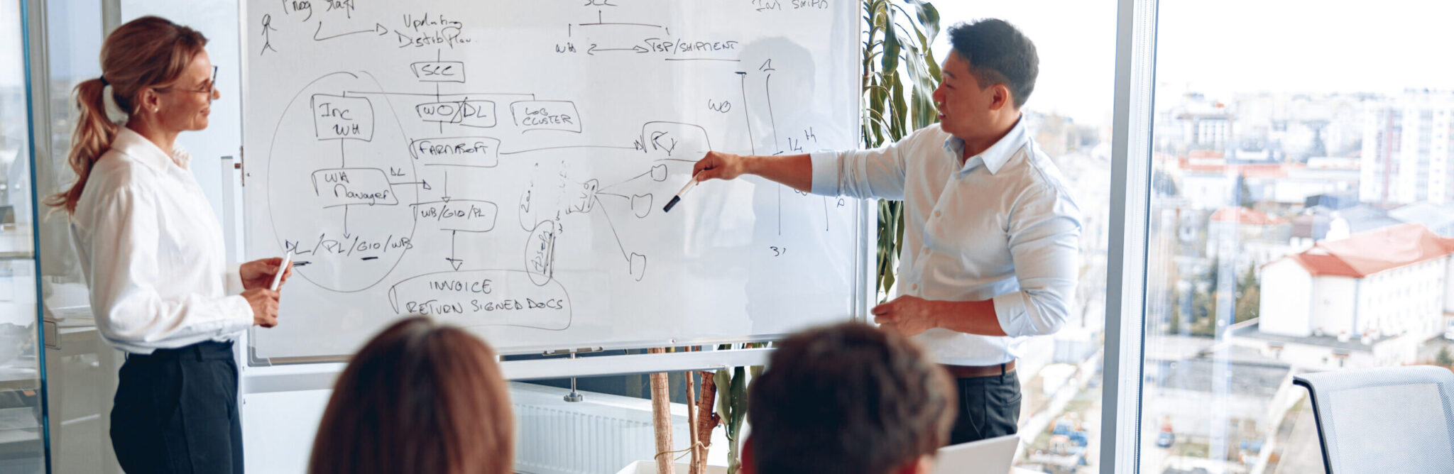 Asian man and woman holding a meeting for employees to improve their skills and teamwork